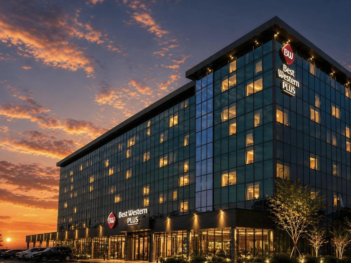 Best Western Plus The Met Tirana, glass façade at dusk